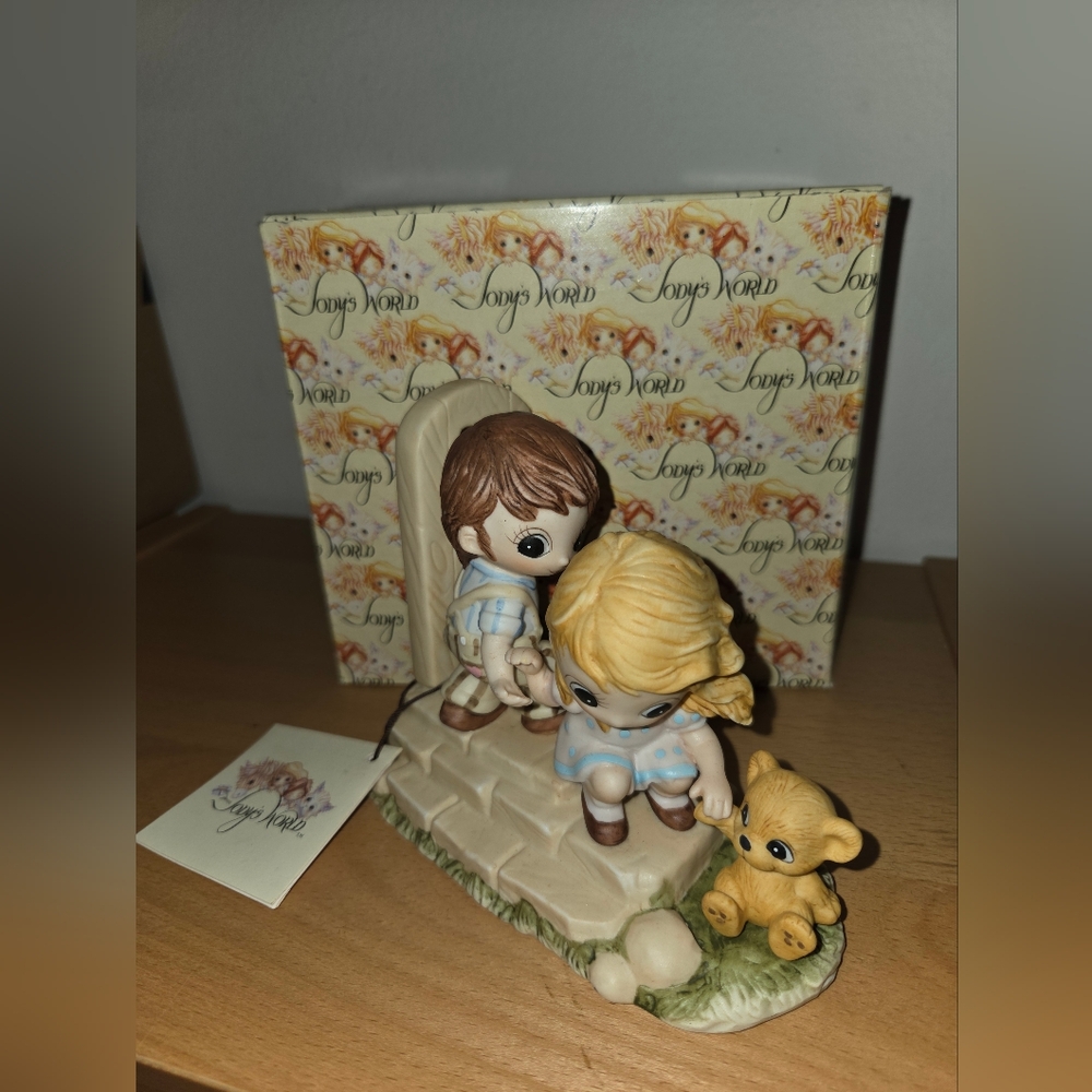 Charming Figurine with Children and Teddy Bear